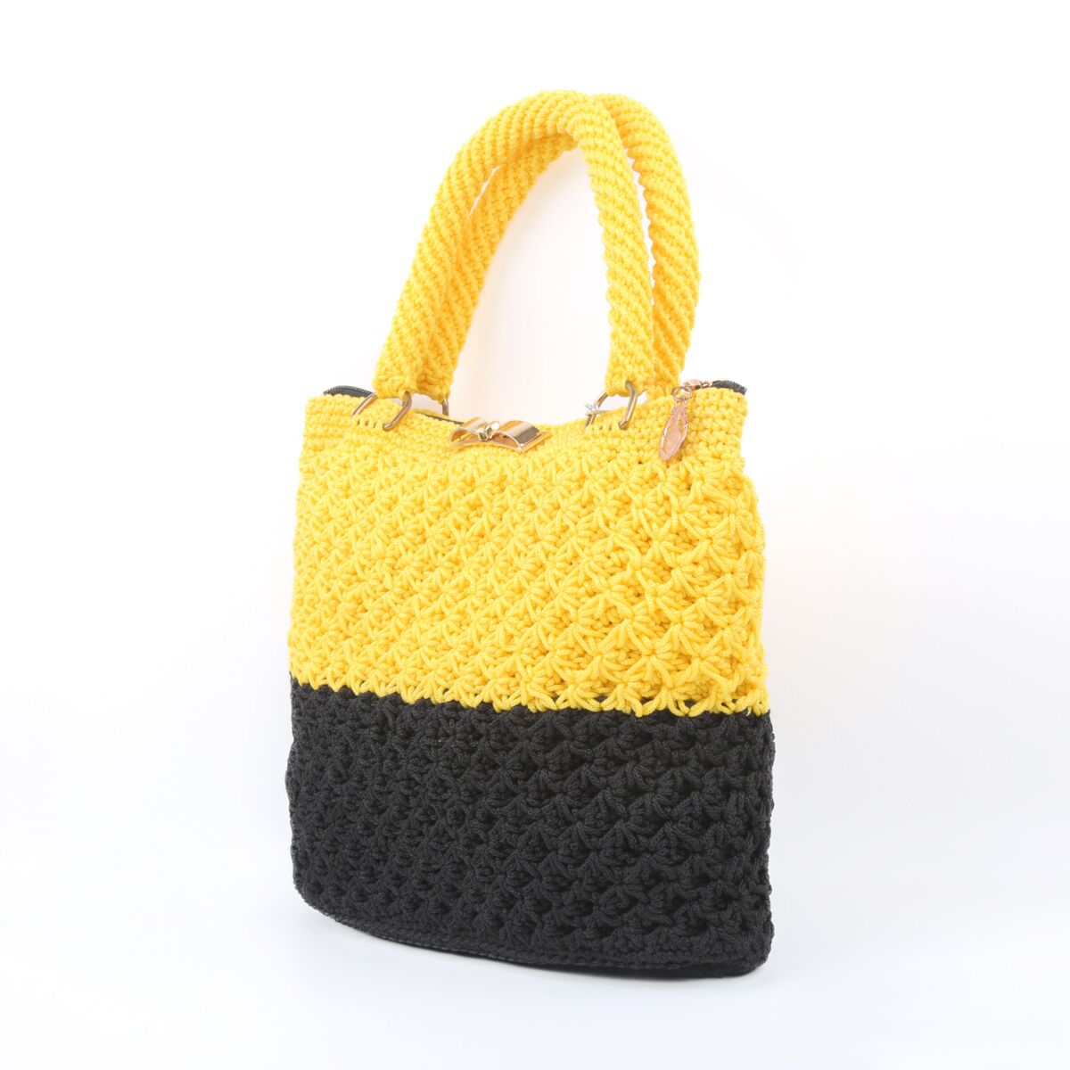 Premium AI Image | a yellow leather purse on a black wood table